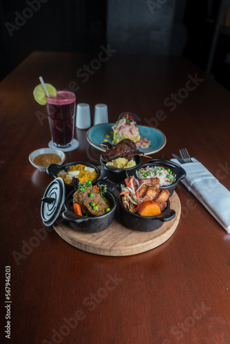 Creole food tray on a restaurant table. © Yuri - Supay 