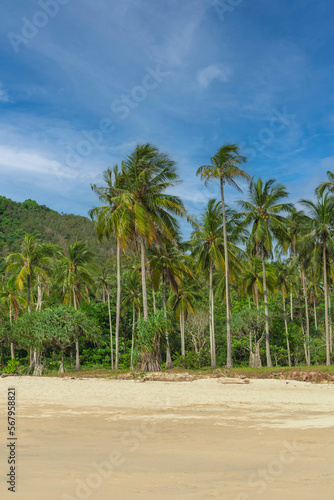 Close up of sand on beach and blue summer sky. Panoramic landscape on the beach. Empty tropical beach