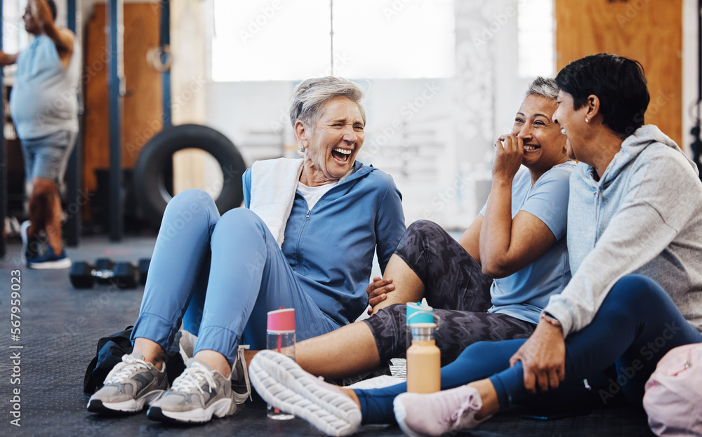 Gym, laughing and group of mature women telling joke after fitness class, conversation and comedy on floor. Exercise, bonding and happy senior woman with friends sitting chatting together at workout. - obrazy, fototapety, plakaty 