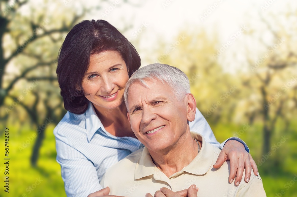 Happy senior old couple together in garden Happy senior old couple together in garden