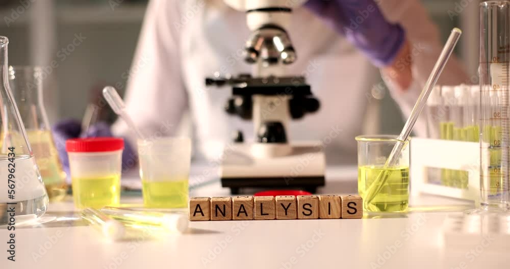 Test tube with yellow urine liquid in glass for chemistry doctor works on microscope Test tube with yellow urine liquid in glass for chemistry doctor works on microscope
