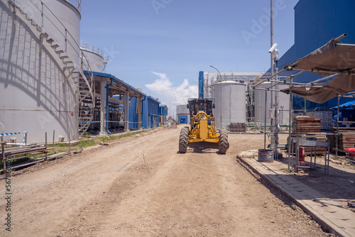 Land scraper and Vibro roller the heavy equipment for pretreatment road construction. photo is suitable to use for industry background photography, power plant poster and electricity content media.