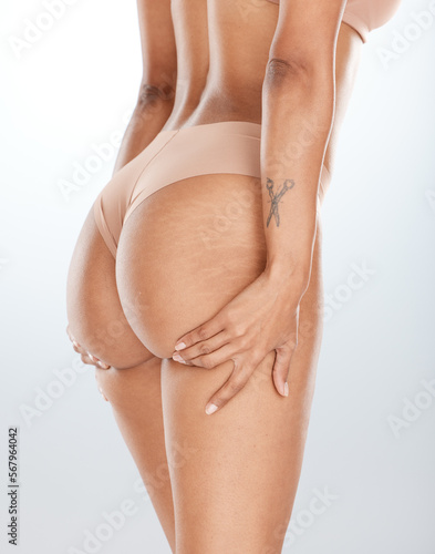 Woman underwear, hands or lifting butt in bum surgery, cellulite goal or stretch mark solution for body liposuction. Zoom, lingerie or model panties on isolated studio background in weight loss check