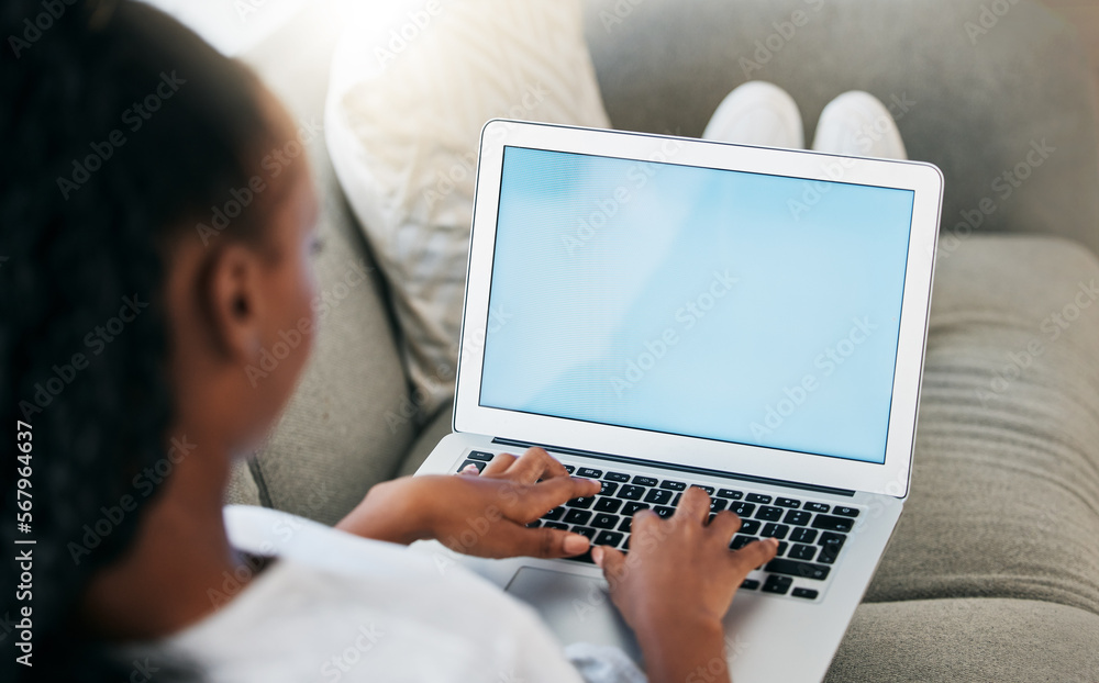 Fototapeta premium Mockup screen, black woman working on laptop for communication, marketing advertising or networking in home living room. Digital, space or girl typing on tech for social media, website or internet