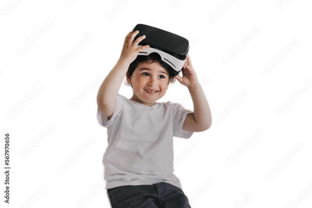 Little cheerful boy smiling wide taking off vr glasses, amazed after using virtual reality googles against transparent background. Playful Spanish boy at home using vr lenses for games. Kid, gamer Little cheerful boy smiling wide taking off vr glasses, amazed after using virtual reality googles against transparent background. Playful Spanish boy at home using vr lenses for games. Kid, gamer