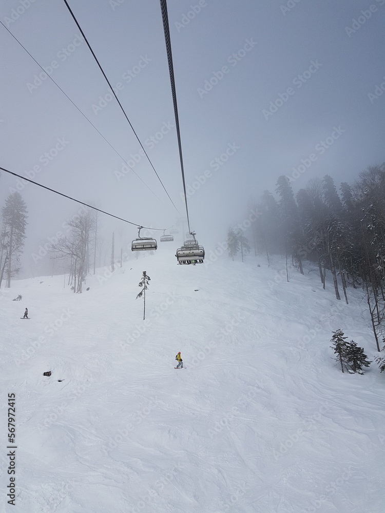 ski lift, recreation in the mountains skiing or snowboarding ski lift, recreation in the mountains skiing or snowboarding