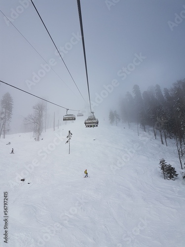 ski lift, recreation in the mountains skiing or snowboarding © Евгения Шолохова
