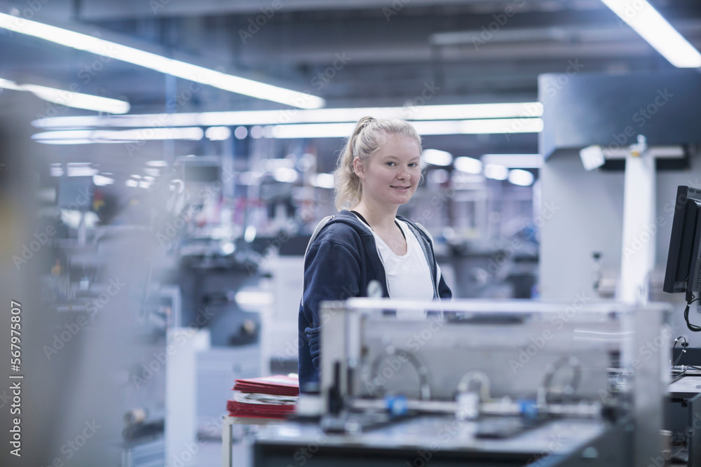 Young woman working in books printing industry, Bremgarten, Hartheim am Rhein, Baden-Wuerttemberg, Germany Young woman working in books printing industry, Bremgarten, Hartheim am Rhein, Baden-Wuerttemberg, Germany