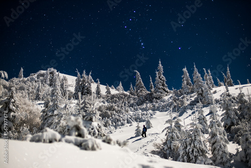 Hiker Under Orion Constellation Cold Sky photo