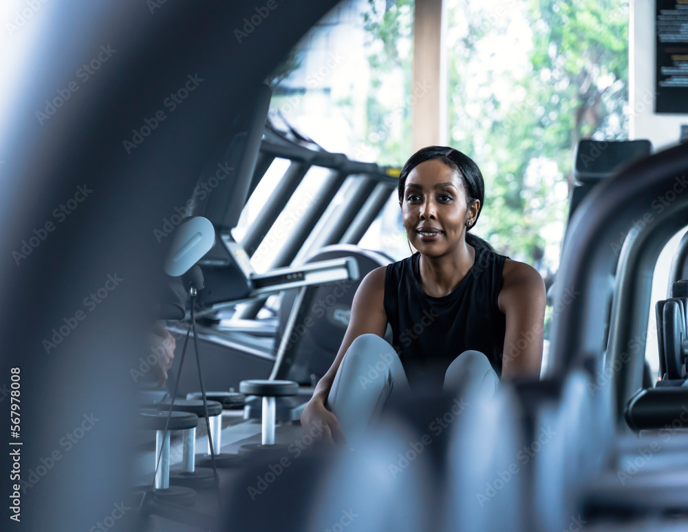 Portrait confident black woman resting at gym Portrait confident black woman resting at gym