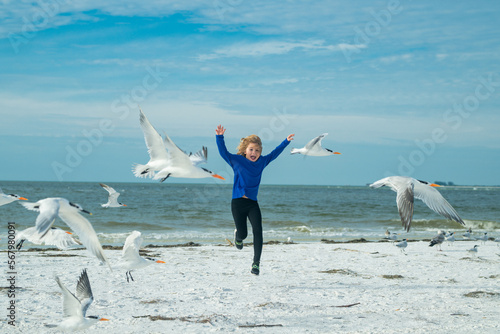 Photography Child chasing birds near summer beach