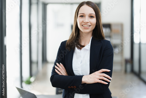 Portrait of a woman business owner showing a happy smiling face as he has successfully invested her business using computers and financial budget documents at work Free Download Portrait of a woman business owner showing a happy smiling face as he has successfully invested her business using computers and financial budget documents at work - GFXLoad