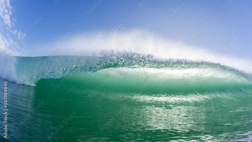 Naklejka premium Wave Swimming Close-Up Face To Face Encounter Sea Water Lip Crashing Breaking Detail Of Ocean Beauty In Morning Back Lit Colors.