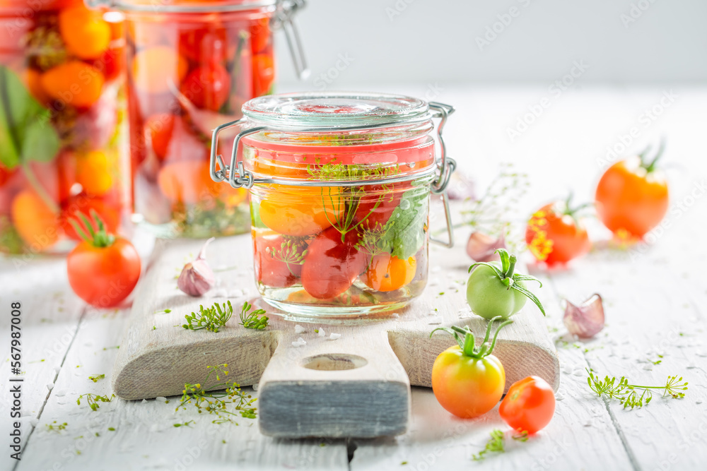 Healthy pickled tomatoes with vegetables from greenhouse. Healthy pickled tomatoes with vegetables from greenhouse.