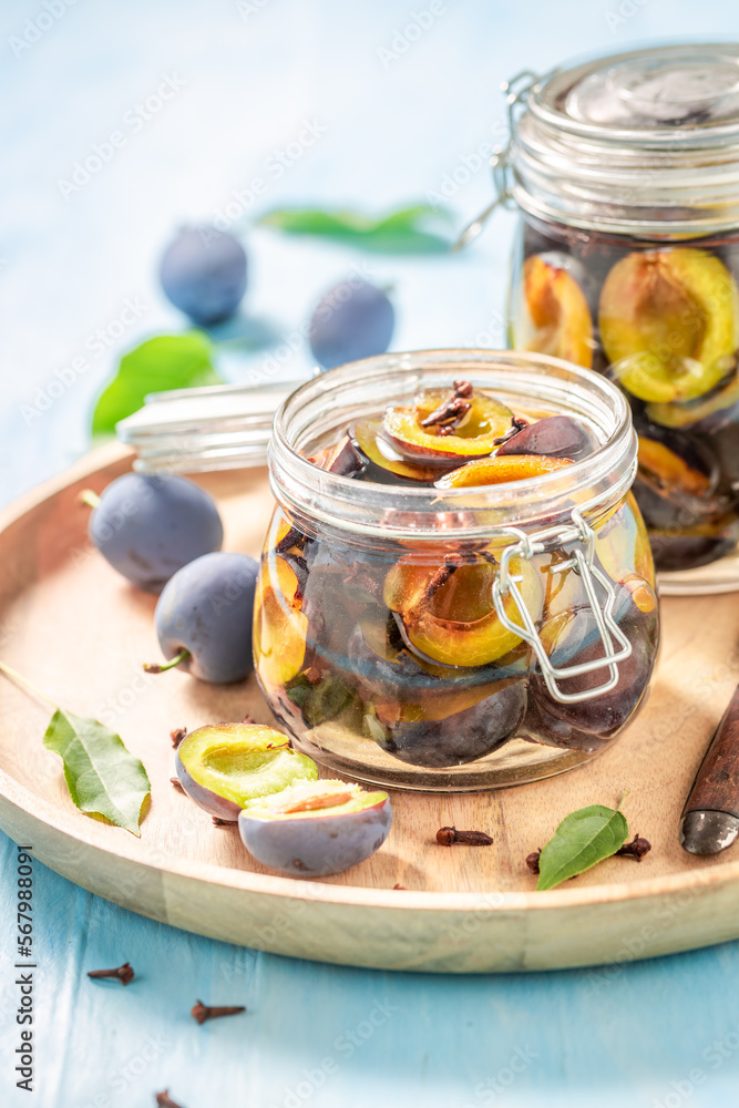 Sweet and tasty pickled plums in jar with spices. Sweet and tasty pickled plums in jar with spices.
