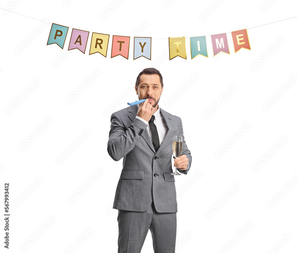 Businessman blowing a horn and holding a glass of champagne at a party Businessman blowing a horn and holding a glass of champagne at a party
