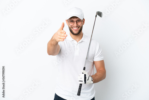 Handsome young man playing golf isolated on white background shaking hands for closing a good deal