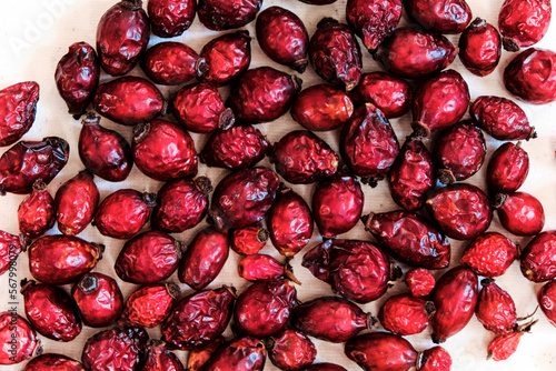 Dried red rose hips (berry, fruit) on white background