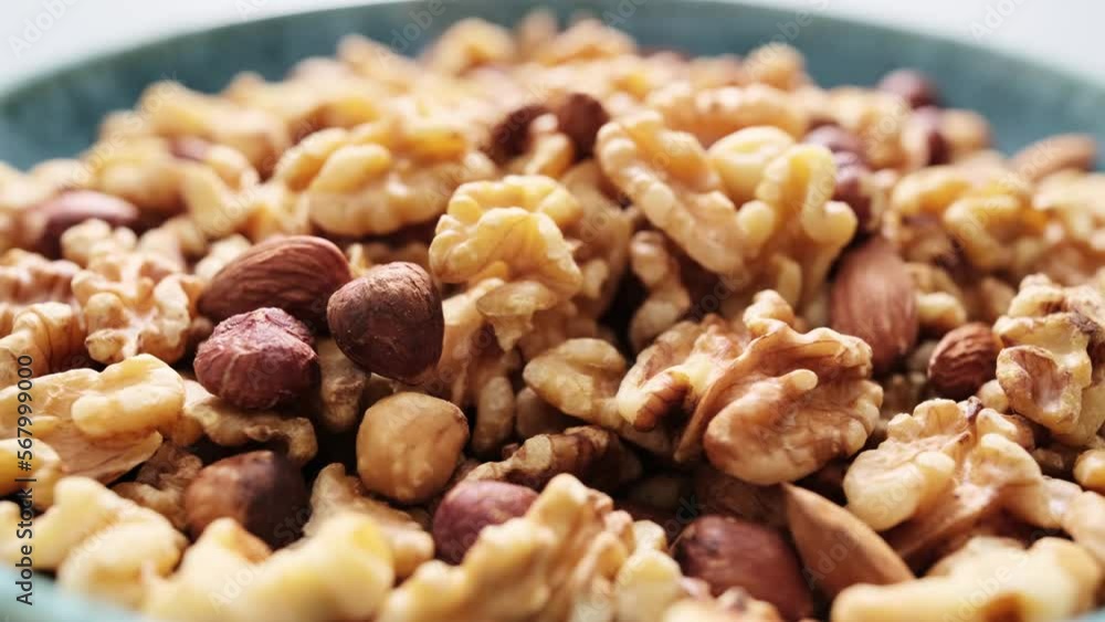 Nut mix of walnuts, hazelnuts and almonds bowl video 4k Nut mix of walnuts, hazelnuts and almonds bowl video 4k