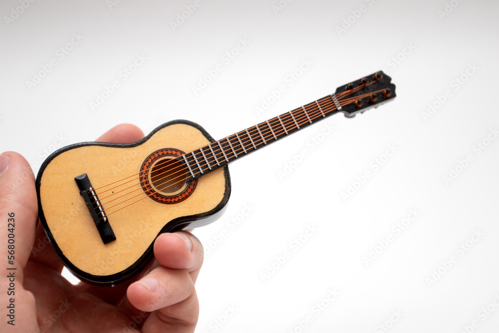 Acoustic Guitar Small Model Toy on hand