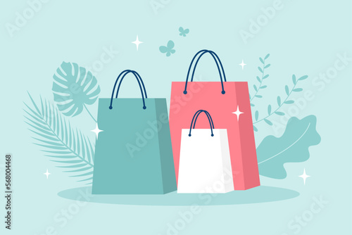 Shopping bags with leaves and sparkles on a green background. Vector illustration in flat style