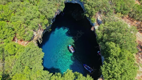 Aerial view of the  iconic Melissani cave with the crystal clear  turquoise waters located near port of Sami, Kefalonia island, Ionian, Greece photo