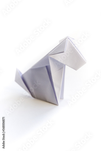 Paper dog origami isolated on a white background