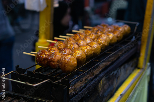 The famous grilled meatballs at Tangerang Old Market. served with sweet soy sauce and sauce. photo