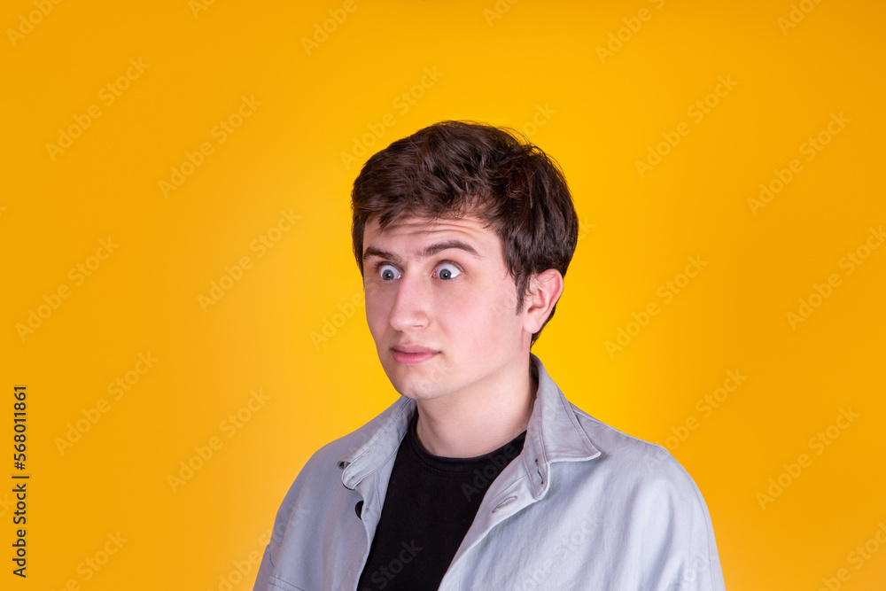 A Handsome guy on yellow background 