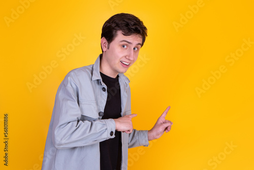 A Handsome guy on yellow background 