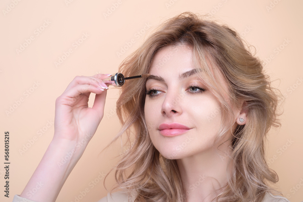 Female model shaping brown eyebrows. Woman eye with beautiful eyebrows. Perfect shaped brow, eyelashes with brow gel brush. Paint eyebrows. Female model shaping brown eyebrows. Woman eye with beautiful eyebrows. Perfect shaped brow, eyelashes with brow gel brush. Paint eyebrows.