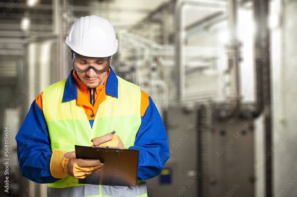 Professional worker in safety hat checking work Professional worker in safety hat checking work