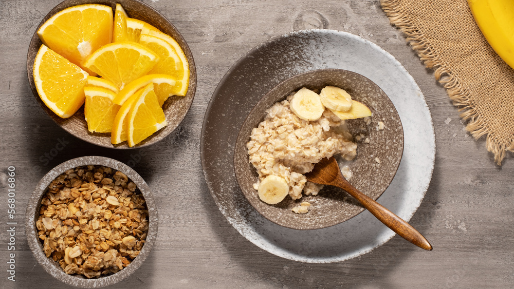 Oatmeal porridge with fruits for healthy breakfast. Table top view Oatmeal porridge with fruits for healthy breakfast. Table top view