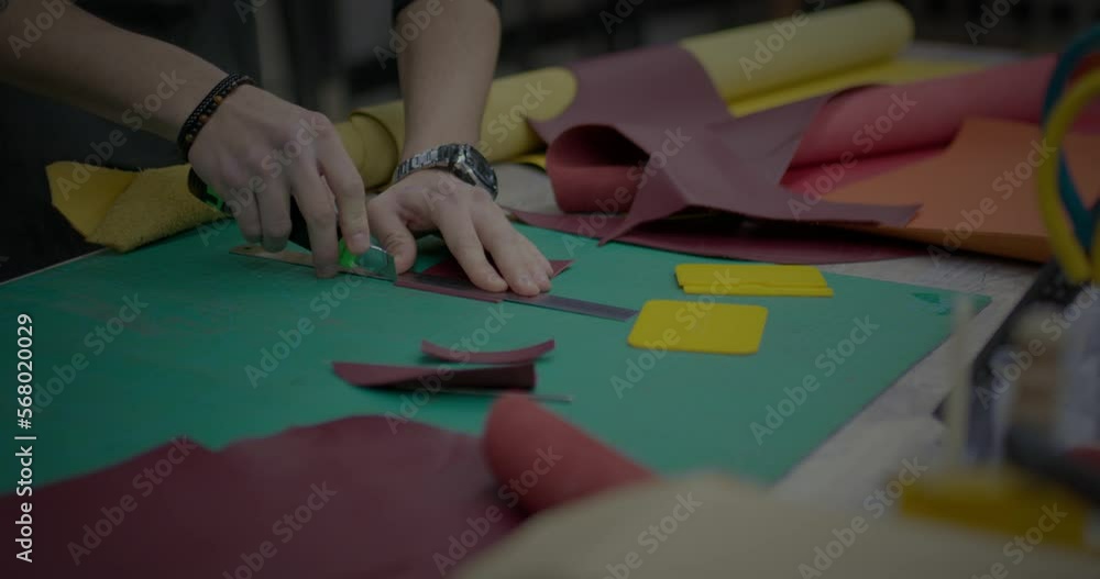 sews a leather bag sews a leather bag