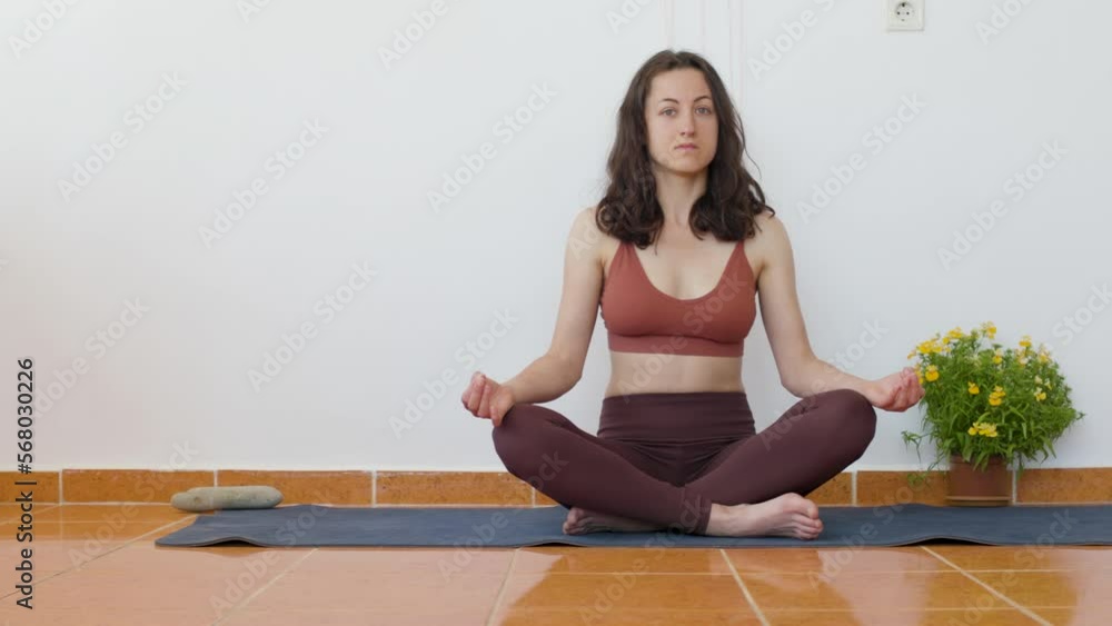 the girl lies on the mat and rests after doing yoga. workout at home. the girl lies on the mat and rests after doing yoga. workout at home.