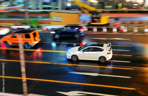 Tokyo, Japan: White Subaru Impreza WRX STI hatchback in Shibuya at night
