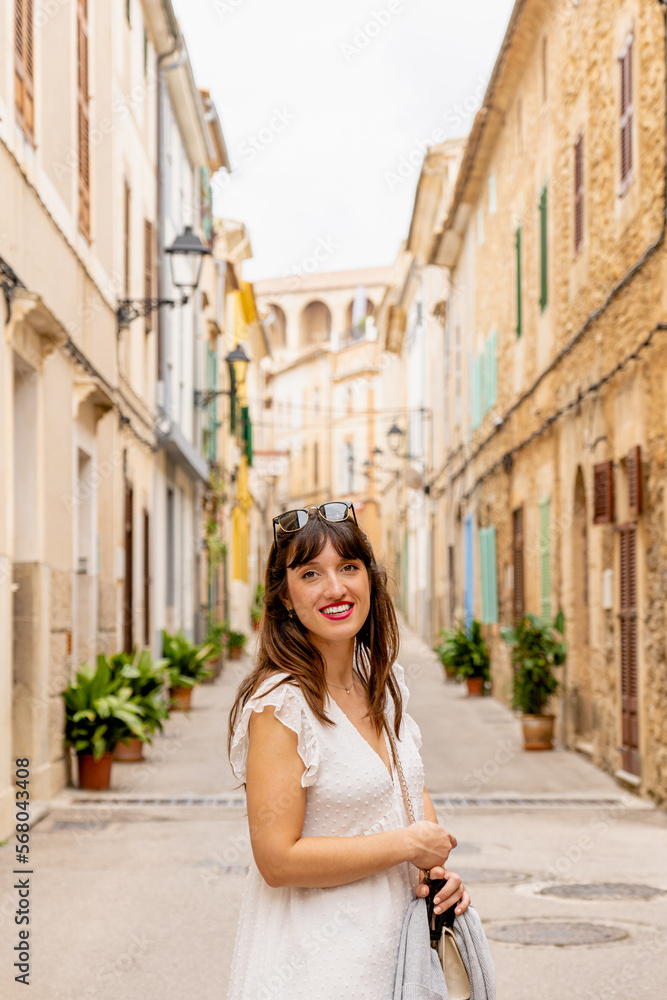 young woman tourist visiting small town in Majorca