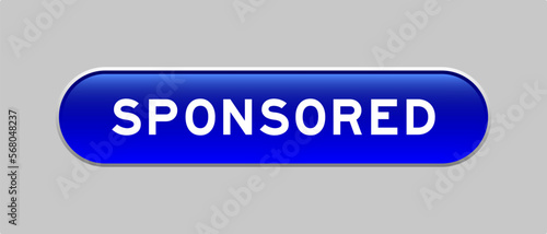 Blue color capsule shape button with word sponsored on gray background