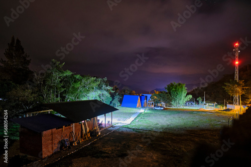Typical nocturnal landscape in a ranch in the jungle, with cabins and bungalows for the night. © Jonathan Chancasana
