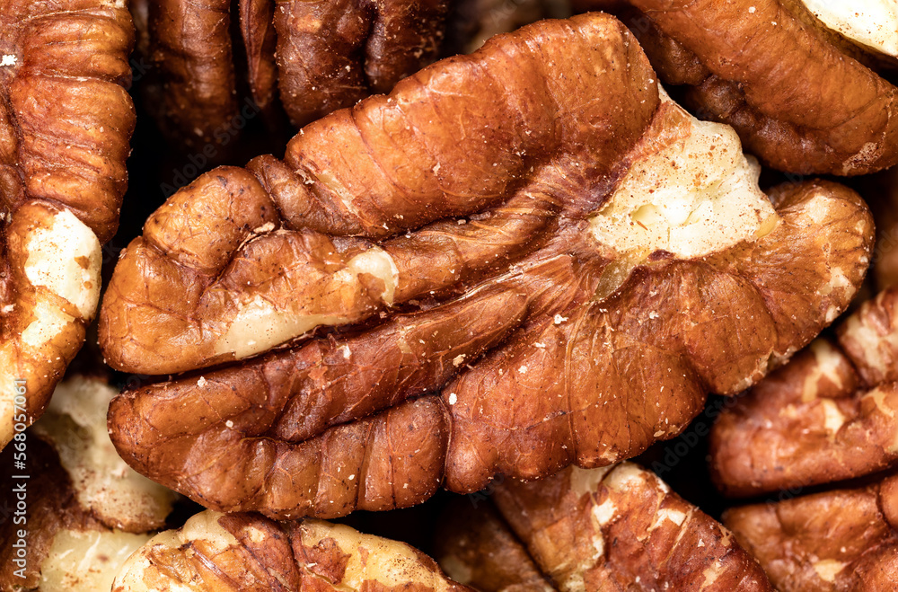 Macro photo of healthy food, toasted pecans. Background and texture of dried fruit, series photo. Macro photo of healthy food, toasted pecans. Background and texture of dried fruit, series photo.