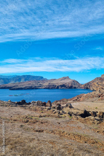 Beautiful red cliffs and mountains on the island of Madeira. Volcanic rocks.