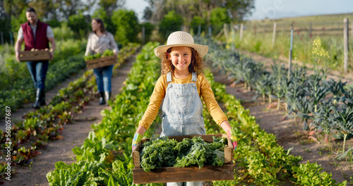 Little girl, farm and agriculture in green harvest for sustainability, organic and production in nature. Portrait of child holding crops in sustainable farming in the countryside for natural resource