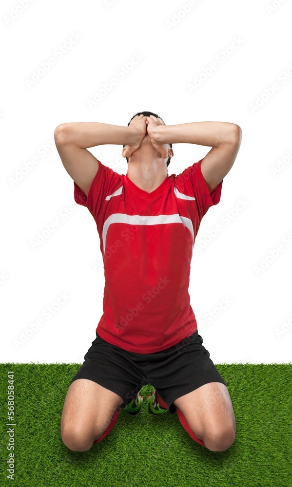 Professional football player shouting after goal with happiness