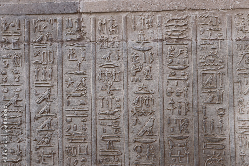Ancient egyptian hieroglyphs at the walls of Kom Ombo in Aswan, Egypt 