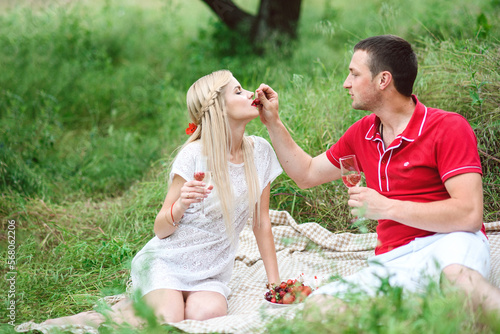 couple in love at a picnic in a park with green grass