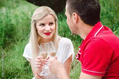 couple in love at a picnic in a park with green grass