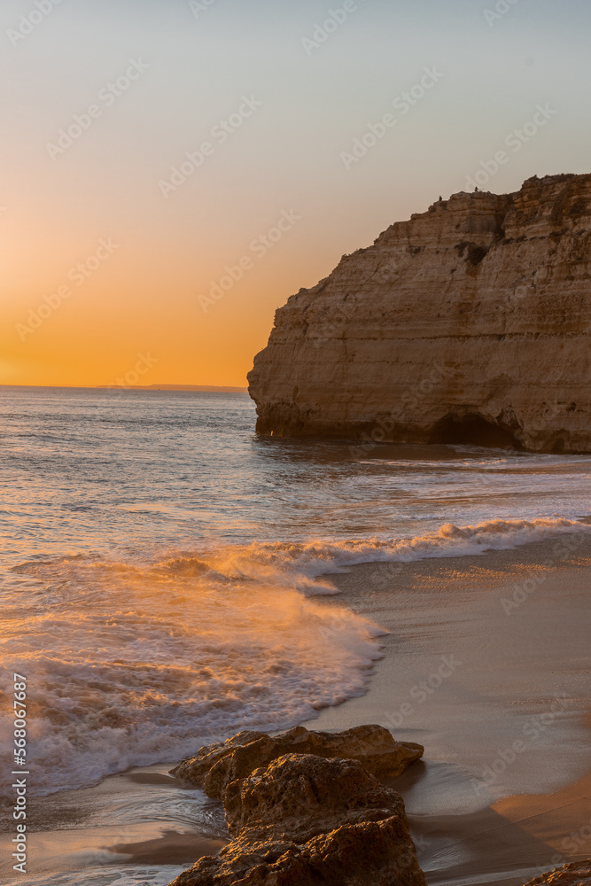 Sunset at the beach near village Carvoeiro, Algarve, Portugal.