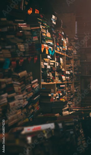 Interior of an old library, with tall stacks of books
