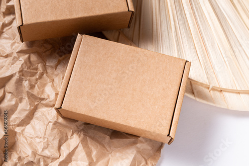 Small brown cardboard box for item shipping, mock up © mdbildes