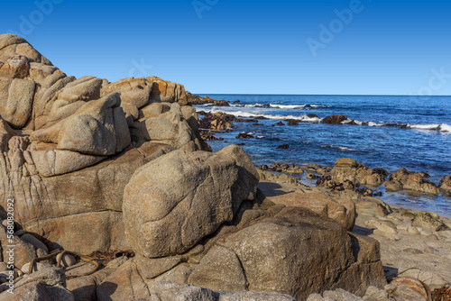 Rock formation on beach with the ocean in the background in Monterey Bay in California